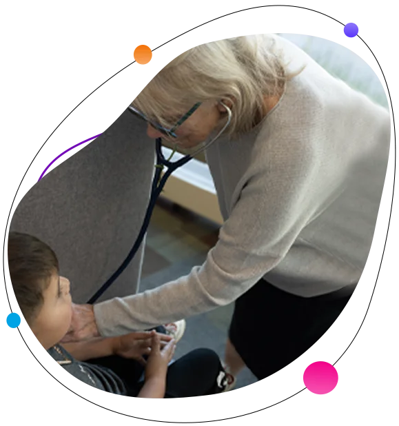 Dr. Lefke Karaviti examining a child during a pediatric endocrinology visit