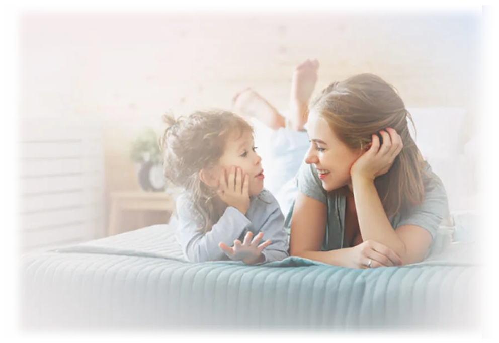 Parent talking with a young child about growth and development